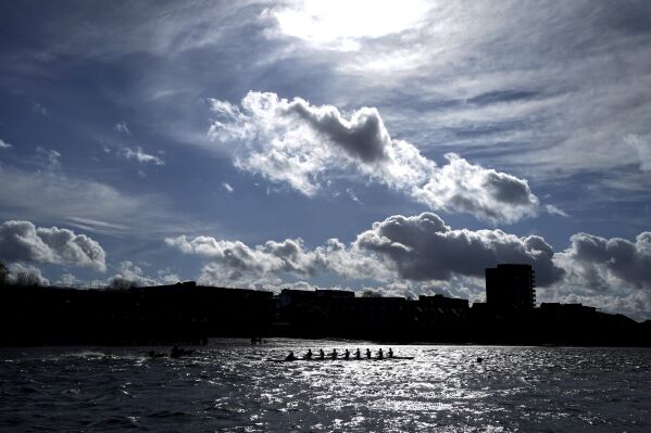 The Cambridge Men's team during a training session on the River Thames in Putney, London, Wednesday March 27, 2024. Jumping into London’s River Thames has been the customary celebration for members of the winning crew in the annual Boat Race between storied English universities Oxford and Cambridge. Now researchers say it comes with a health warning. (Zac Goodwin/PA via AP)