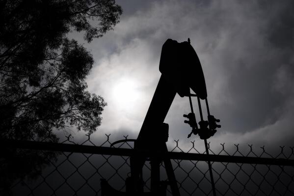 A pumpjack operates on Jan. 15, 2015, in Bakersfield, Calif. Residents of Bakersfield are concerned about potential explosions after a state agency found that six idle oil wells near homes were leaking methane in the past several days.  (AP Photo/Jae C. Hong)