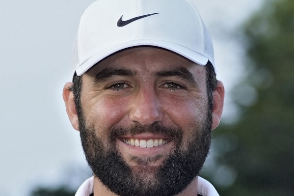 FILE - Scottie Scheffler smiles after winning The Players Championship golf tournament Sunday, March 17, 2024, in Ponte Vedra Beach, Fla. Scheffler will be competing in the 2024 Masters golf tournament. (AP Photo/Marta Lavandier, File)