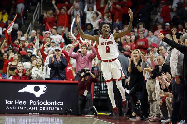North Carolina State's Terquavion Smith (0) celebrates a win over Miami in an NCAA college basketball game in Raleigh, N.C., Saturday, Jan. 14, 2023. (AP Photo/Karl B DeBlaker)