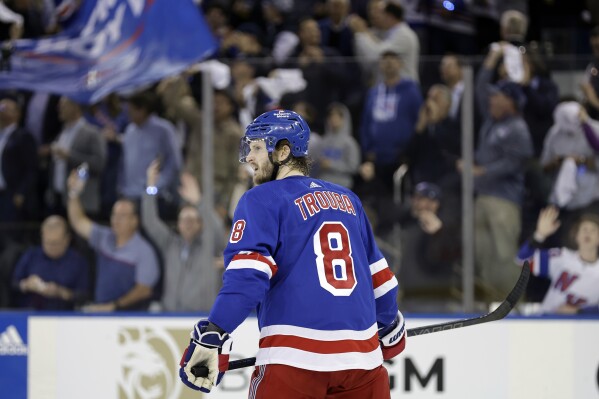 New York Rangers defenseman Jacob Trouba reacts after scoring a goal against the Carolina Hurricanes in the second period during Game 5 of an NHL hockey Stanley Cup second-round playoff series, Monday, May 13, 2024, in New York. (AP Photo/Adam Hunger)