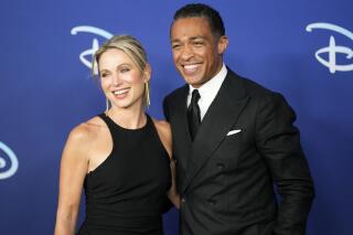 FILE - Amy Robach, left, and T. J. Holmes appear the Disney 2022 Upfront presentation on May 17, 2022, in New York. Holmes and Amy Robach, anchors at the afternoon extension of ABC’s “Good Morning America,” are leaving the network. Their romance was revealed when photos of them holding hands and spending time together surfaced in November. (Photo by Charles Sykes/Invision/AP, File)