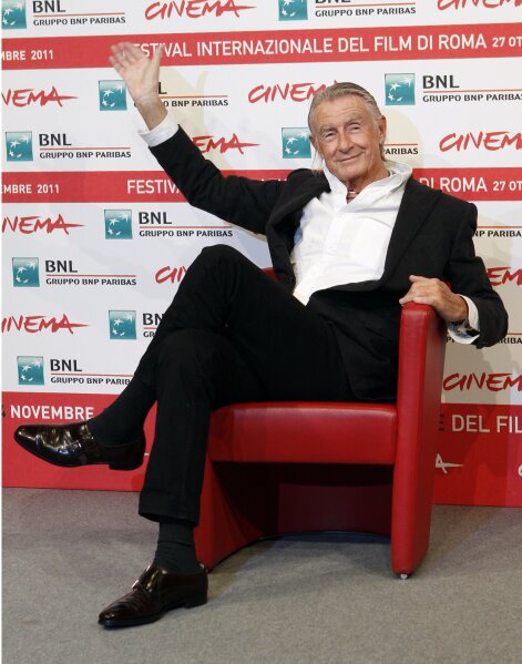 FILE - In this Nov. 3, 2011 file photo, director Joel Schumacher waves during a photo call for Cinema and Advertising: Joel Schumacher directs Campari, at the Rome International Film Festival. A representative for Schumacher said the filmmaker died Monday, June 22, 2020, in New York after a year-long battle with cancer. He was 80. (AP Photo/Pier Paolo Cito, File)