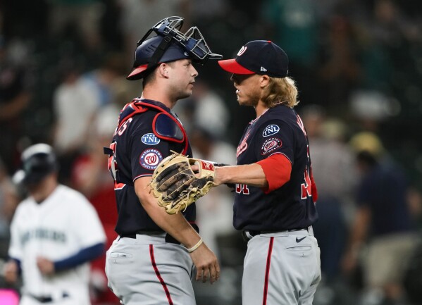 ATLANTA, GA - JULY 08: Washington Nationals relief pitcher Jordan Weems  (51) prepares to deliver a pitch during the Friday evening MLB game between  the Washington Nationals and the Atlanta Braves on