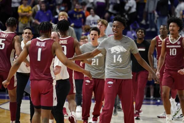 Arkansas celebrates after defeating LSU in an NCAA college basketball game in Baton Rouge, La., Saturday, Jan. 15, 2022. Arkansas won 65-58. (AP Photo/Gerald Herbert)
