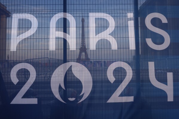 FILE - The Eiffel Tower is seen behind a Paris Olympics canvas, from the Trocadero plaza Thursday, July 18, 2024 in Paris. (ĢӰԺ Photo/David Goldman, File)