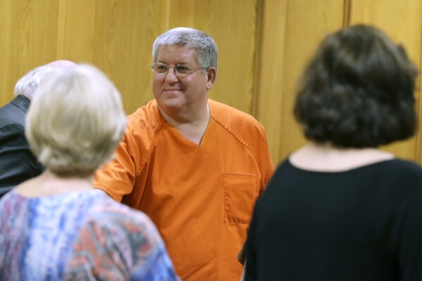 FILE - Bernie Tiede smiles after a court hearing granting his release, May 6, 2014, at the Panola County Courthouse in Carthage, Texas. Advocates for Texas prisoners on Monday, April 22, 2024, asked to join a federal lawsuit filed last year by Tiede, who has alleged his life is in danger because he was being housed in a stifling prison cell without air conditioning. He was later moved to an air-conditioned cell. (AP Photo/LM Otero, File)