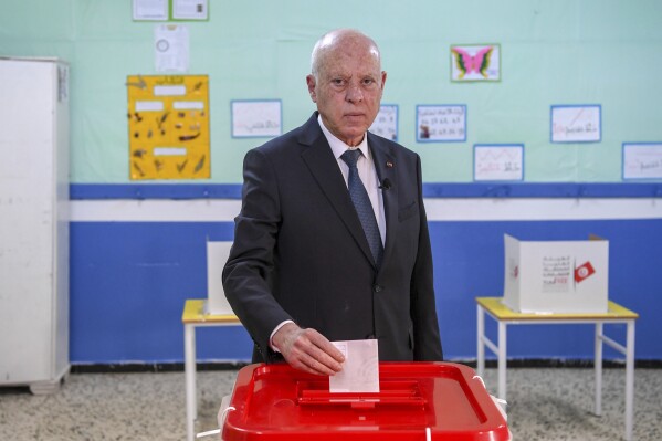 FILE - Tunisia's President Kais Saied casts his ballot as he participates in the legislative elections in Tunis, Dec. 17, 2022. Tunisia’s main opposition coalition said Tuesday, April 30, 2024, it won’t take part in the upcoming presidential election unless Saied’s political opponents are freed and judicial independence is restored. Saied is widely expected to seek reelection, but it is unclear if anyone will challenge him. (AP Photo/Slim Abid, File)