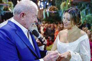 In this photo released by the 2022 campaign press office of Luiz Inacio Lula da Silva, Brazil's former president Luiz Inacio Lula da Silva, left, and sociologist Rosangela Silva get married in Sao Paulo Brazil, Wednesday, May 18, 2022. Brazil's former president and front-runner for October's elections Da Silva got married in a ceremony that had a political touch as he seeks to return to the office he held between 2003 and 2010. (Ricardo Stuckert/Lula 2022 Campaign Press Office via AP)