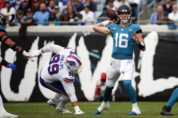 Denver Broncos kicker Brandon McManus (8) talks with Raiders interim head  coach Rich Bisaccia b …