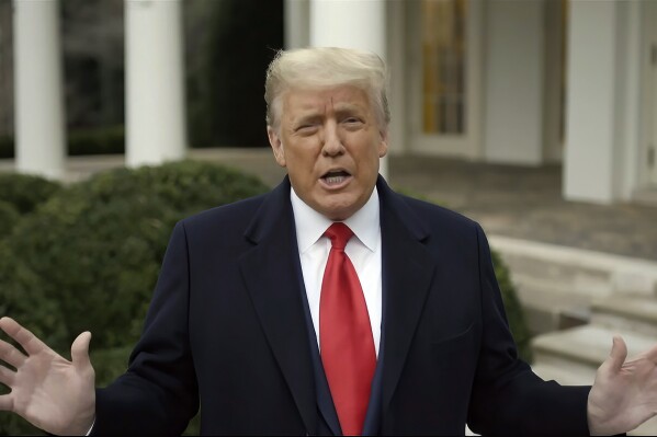 FILE - This exhibit from video released by the House Select Committee, shows President Donald Trump recording a video statement on the afternoon of Jan. 6, 2021, from the Rose Garden at the White House in Washington. Trump's lawyers have suggested their strategy in his election interference case in Washington involves distancing their client from the horde of U.S. Capitol rioters, whom the former president has embraced on the campaign trail.(House Select Committee via AP)