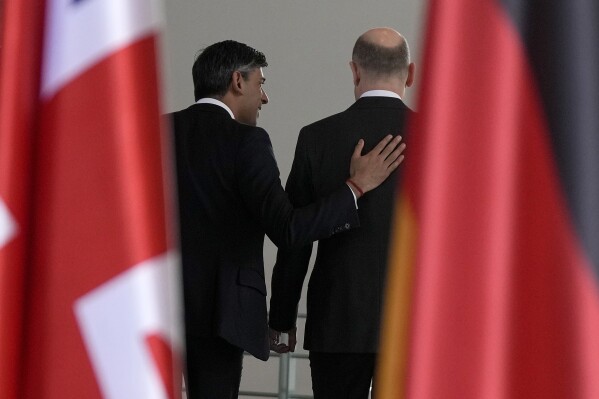 Britain's Prime Minister Rishi Sunak and German Chancellor Olaf Scholz leave after a press conference in Berlin, Germany, Wednesday, April 24, 2024.(AP Photo/Alastair Grant, Pool)