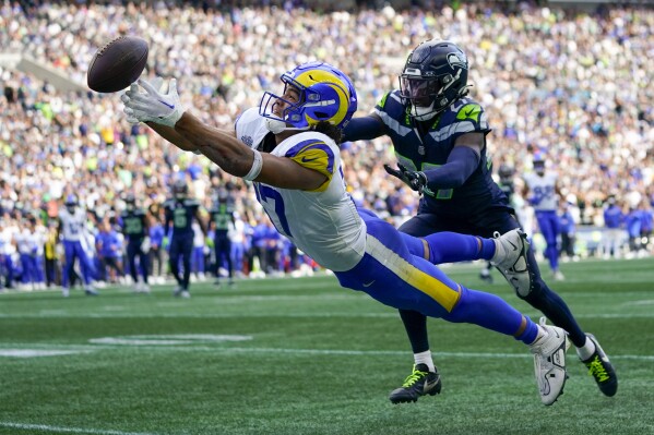 Seattle Seahawks cornerback Riq Woolen breaks up a pass intended for Los Angeles Rams wide receiver Puka Nacua during the second half of an NFL football game Sunday, Sept. 10, 2023, in Seattle. (AP Photo/Lindsey Wasson)