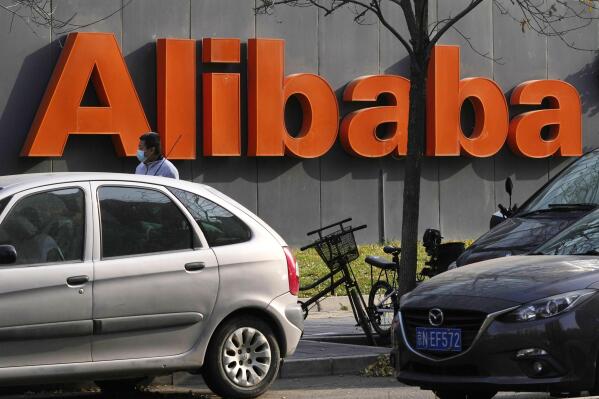 FILE - The Alibaba logo is seen outside a building in Beijing on Nov. 16, 2021. Alibaba, China’s biggest e-commerce company, said Tuesday, July 26, 2022, that it would apply for a primary listing in Hong Kong. (AP Photo/Ng Han Guan, File)