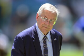 FILE - Buffalo Bills owner Terry Pegula walks on the sidelines during an NFL football game against the Miami Dolphins, Sunday, Sept. 25, 2022, in Miami Gardens, Fla. The NFL Buffalo Bills and NHL Sabres will operate as separate entities after the teams’ owner Terry Pegula dissolved their parent company. The move to dissolve Pegula Sports and Entertainment is being referred to as one that will allow each the teams to focus singularly on their efforts.(AP Photo/Doug Murray, File)