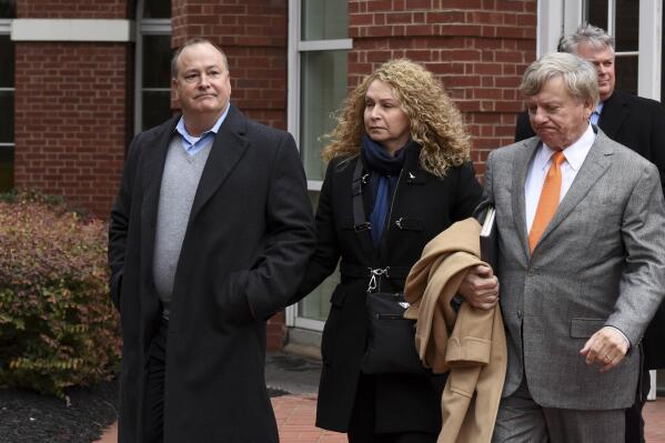 FILE - In this Feb. 9, 2016, file photo, former Pilot Flying J president Mark Hazelwood, left, leaves federal court after being arraigned in Knoxville, Tenn. Hazelwood, the former president of Pilot Co. wants a Black federal judge to recuse himself from overseeing the retrial of a fraud case against him. Hazelwood claims the judge appeared biased against him after hearing a recording of him making racist remarks at the first trial. (Michael Patrick /Knoxville News Sentinel via AP, File)
