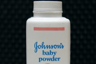 FILE - In this April 15, 2011, file photo, a bottle of Johnson's baby powder is displayed. Johnson & Johnson is ending production of its iconic talc-based Johnson’s Baby Powder, which has been embroiled in thousands of lawsuits claiming it caused cancer. The world’s biggest maker of health care products said Tuesday, May 19, 2020 that the discontinuation only affects the U.S. and Canada, where demand has been declining. (AP Photo/Jeff Chiu, File)