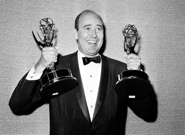 FILE - In this May 26, 1963 file photo, Carl Reiner shows holds two Emmy statuettes presented to him as best comedy writer for the "Dick Van Dyke Show," during the annual Emmy Awards presentation in Los Angeles. Reiner, the ingenious and versatile writer, actor and director who broke through as a “second banana” to Sid Caesar and rose to comedy’s front ranks as creator of “The Dick Van Dyke Show” and straight man to Mel Brooks’ “2000 Year Old Man,” has died, according to reports. Variety reported he died of natural causes on Monday night, June 29, 2020, at his home in Beverly Hills, Calif. He was 98. (AP Photo, File)