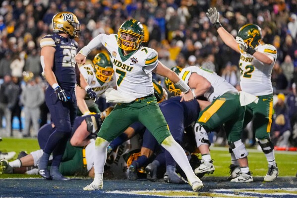 North Dakota State quarterback Cam Miller reacts after teammate running back CharMar Brown scored on a touchdown against Montana State in the second half of the FCS Championship NCAA college football game, Monday, Jan. 6, 2025, in Frisco, Texas. (AP Photo/Julio Cortez, File)