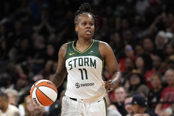 FILE - Seattle Storm guard Epiphanny Prince (11) brings the ball up court during Game 2 of a WNBA basketball semifinal playoff series against against the Las Vegas Aces, Wednesday, Aug. 31, 2022, in Las Vegas. Prince announced her retirement on social media after playing 14 seasons in the WNBA. The 36-year-old guard retired after averaging 10.7 points, 2.5 assists and 1.4 steals in 315 career games with Chicago, Las Vegas, Seattle and New York. (AP Photo/John Locher, File)