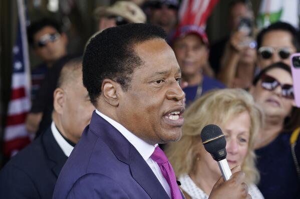 FILE - In this July 13, 2021, file photo, gubernatorial candidate and radio talk show host Larry Elder speaks to supporters during a campaign stop in Norwalk, Calif. In two short months, Larry Elder emerged from the province of conservative talk radio to dominate the Republican field in the California recall election that could remove Democratic Gov. Gavin Newsom from office, drawing national headlines, attracting fervent crowds to his rallies and quickly banking millions of dollars for his first campaign. (AP Photo/Marcio Jose Sanchez, File)
