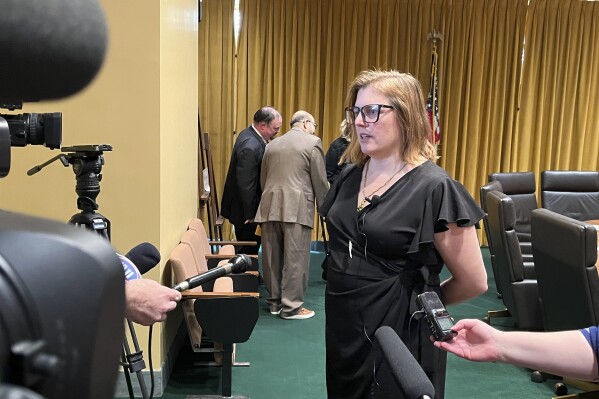 Nebraska state Sen. Machaela Cavanaugh speaks to reporters Thursday, March 18, 2024, following a hearing of the Legislature's Executive Board on a measure that would censure Republican state Sen. Steve Halloran for remarks he made on the legislative floor March 18. (AP Photo/Margery Beck)