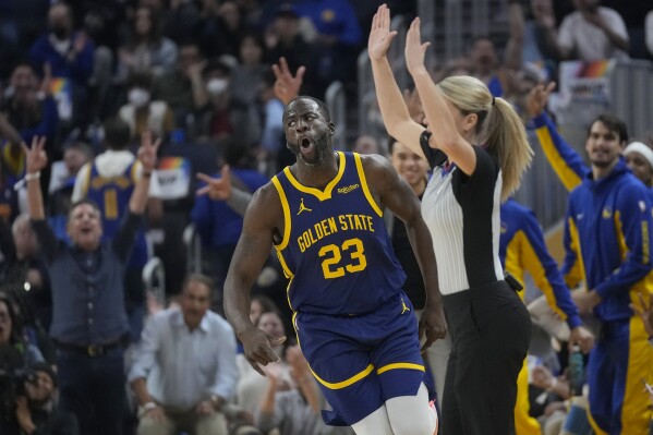 Golden State Warriors forward Draymond Green (23) reacts after making a 3-point basket during the first half of an NBA basketball game against the Sacramento Kings in San Francisco, Wednesday, Nov. 1, 2023. (AP Photo/Jeff Chiu)