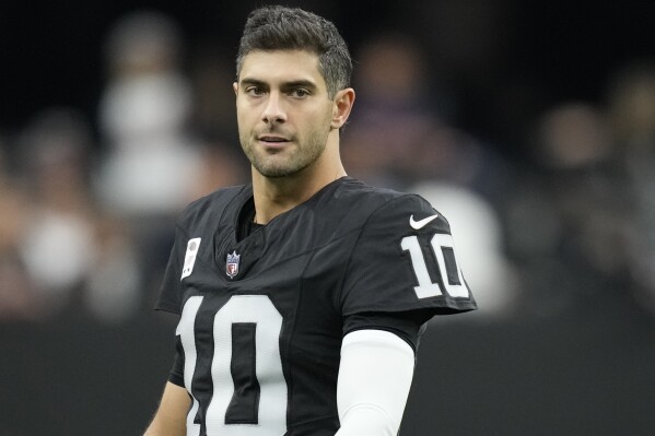 FILE - Las Vegas Raiders quarterback Jimmy Garoppolo (10) is shown before an NFL football game against the Denver Broncos, Sunday, Jan. 7, 2024, in Las Vegas. The NFL announced Friday, Feb. 16, that Raiders quarterback Jimmy Garoppolo was suspended for the first two games of next season for violating performance-enhancing drugs policy of the league and NFL Players Association.(APPhoto/John Locher, File)