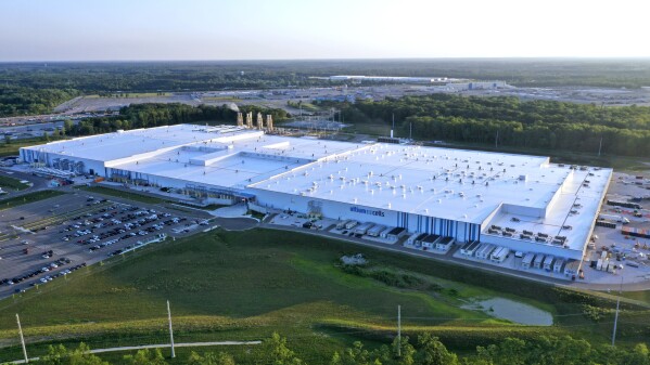 FILE - The Ultium Cell factory in Warren, Ohio, is shown, July 7, 2023, where General Motors stacks battery cells into modules, a joint venture with LG Energy Solution of Korea. Former President Donald Trump and other Republicans portray Biden's policy to promote electric vehicles as unfair for consumers and government overreach. Biden and Democrats have been less vocal and more nuanced, advocating Biden's climate reduction goals while promoting homegrown technology over competition from China. (AP Photo/Gene J. Puskar, File)