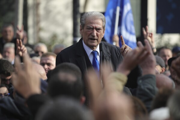 FILE - Sali Berisha, leader of the opposition Democratic Party, speaks to his supporters An Albanian court on Saturday, Dec. 30, 2023, ordered house arrest for former Prime Minister Sali Berisha, who leads the opposition Democratic Party and is being investigated for possible corruption. (AP Photo/Armando Babani, File)