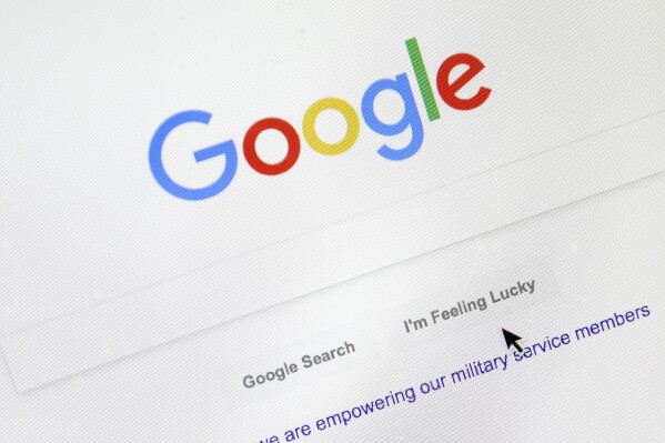 FILE - A cursor moves over Google's search engine page, Aug. 28, 2018, in Portland, Ore. On Tuesday, Sept. 26, 2023, a top Apple executive defended the tech giant鈥檚 decision to make Google the default search engine on Apple iPhones and Macs, saying there was no 鈥渧alid alternative.鈥欌�� (APPhoto/Don Ryan, File)