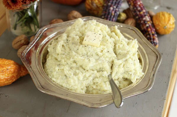 FILE - A bowl of brown butter rosemary mashed potatoes appears in Concord, N.H., on Oct. 5, 2015. The Associated Press-NORC Center for Public Affairs Research looks at the state of the country's Thanksgiving favorites. (AP Photo/Matthew Mead, File)