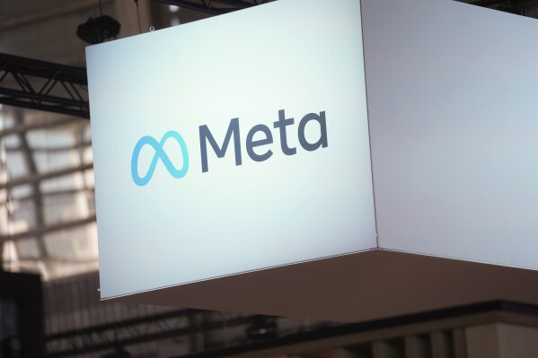 FILE - The Meta logo is seen at the Vivatech show in Paris, June 14, 2023. Facebook and Instagram parent company Meta is keeping its promise to block news content in Canada on its platforms in response to a new law that requires tech giants to pay publishers for linking to or otherwise repurposing their content online. (AP Photo/Thibault Camus, File)