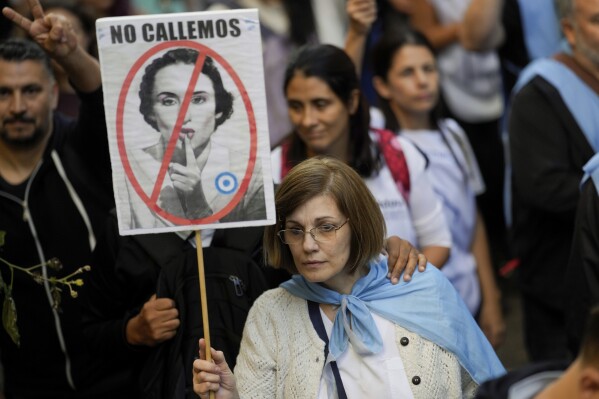 People march to demand more funding for public universities and protest against austerity measures proposed by President Javier Milei in Buenos Aires, Argentina, Tuesday, April 23, 2024. (AP Photo/Natacha Pisarenko)