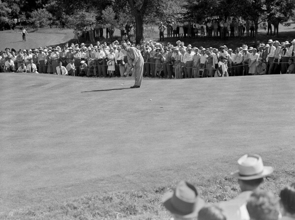 FILE - Craig Wood drops a 12-foot putt on No. 6 at Colonial in Fort Worth, Texas, June 7, 1941. There are plenty of modern upgrades at “Hogan's Alley,” but a significant goal of the $20 million-plus project was to restore the course to much of it original form. Colonial Country Club opened in 1936, five years before a U.S. Open was there and 10 years before it began hosting what is now the longest-running PGA Tour event at the same venue. (AP Photo, File)