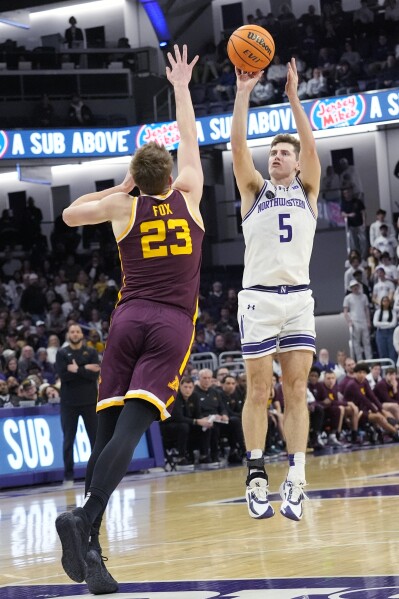 Northwestern guard Ryan Langborg, right, shoots over Minnesota forward Parker Fox, left, during the second half of an NCAA college basketball game in Evanston, Ill., Saturday, March 9, 2024. (AP Photo/Nam Y. Huh)