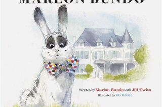 This cover image released by Chronicle Books shows "Last Week Tonight With John Oliver Presents A Day in the Life of Marlon Bundo," written by Marlon Bundo with Jill Twiss and illustrated by EG Keller. The book was among the books most objected to in 2018 at the country’s public libraries. The best-selling parody ranked No. 2 on the list of “challenged” books compiled by the American Library Association, with some complaining about its gay-themed content and political viewpoint. (Chronicle Books via AP)