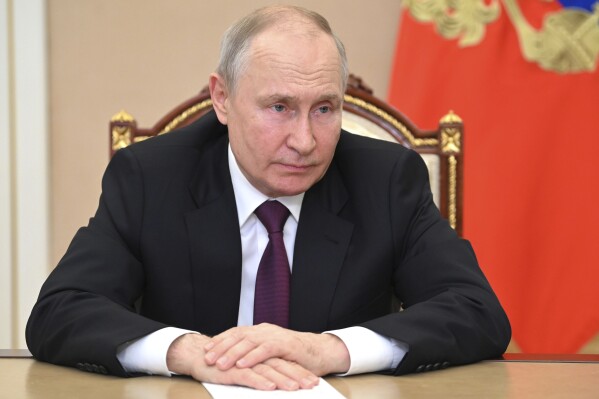 Russian President Vladimir Putin chairs a meeting on economic issues via a video conference at the Kremlin in Moscow, Russia, Tuesday, July 25, 2023. (Alexander Kazakov, Sputnik, Kremlin Pool Photo via AP)