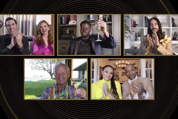 In this video grab issued Sunday, Feb. 28, 2021, by NBC, nominees in the category for best supporting actor in a motion picture react as Daniel Kaluuya, top center, is announced as the winner for his role in "Judas and the Black Messiah" at the Golden Globe Awards. (NBC via AP)