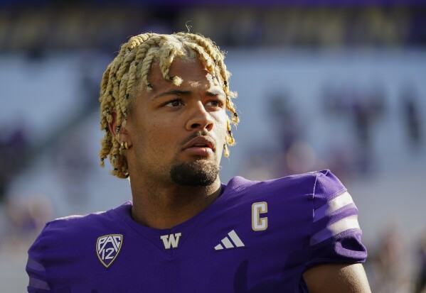 FILE - Washington wide receiver Rome Odunze looks into the stands after an NCAA college football game against Tulsa, Sept. 9, 2023, in Seattle. Odunze, who played the middle portion of the year with a broken rib and finished the year as a first-team All-American on seemingly every list, will face No. 3 Texas in the Sugar Bowl Monday, Jan. 1, 2024. (AP Photo/Lindsey Wasson, File)