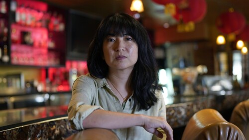 Ashley Cheng poses for a photo at her father's restaurant, Chinatown, in Austin, Texas, Wednesday, June 28, 2023. Cheng, the founding president of Asian Texans for Justice, recalls discovering her mother was not listed in the voter rolls when she tried to help her vote in 2018. They never found out why she wasn’t properly registered. Advocates say this highlights flaws in the system and illustrates how volunteers are essential to overcoming them. (AP Photo/Eric Gay)