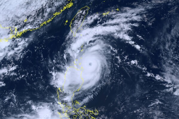 This satellite image provided by courtesy of the National Institute of Information and Communications Technology (NICT) shows Typhoon Saola moving north towards Taiwan, Tuesday, Aug. 29, 2023. Taiwan’s weather authorities warned residents of heavy rain and strong winds starting Wednesday as Typhoon Saola skirts by the island’s southern coast on its way to China's southern coast. (Courtesy of National Institute of Information and Communications Technology (NICT) via AP)