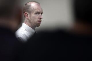 FILE - Chad Isaak, of Washburn, N.D., appears during the third day of his murder trial at the Morton County Courthouse in Mandan, N.D., on Aug. 4, 2021. Isaak is scheduled for sentencing Tuesday, Dec. 28, 2021, in the stabbing and shooting deaths of four people at a North Dakota property management firm last year. Isaak is facing life in prison without parole. A jury in August found him guilty in the grisly deaths of RJR Maintenance and Management co-owner Robert Fakler and three employees. (Mike McCleary/The Bismarck Tribune via AP, File)