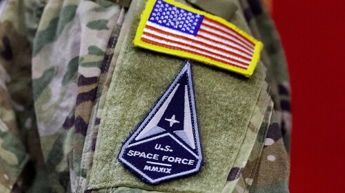 FILE - A solider wears a U.S. Space Force uniform during a ceremony for U.S. Air Force airmen transitioning to U.S. Space Force guardian designations at Travis Air Force Base, Calif., Feb. 12, 2021. Amid a freeze in military-to-military contacts, China is accusing the United States of militarizing outer space, a day after it protested the passage of a U.S. Navy P-8A Poseidon anti-submarine aircraft through the Taiwan Strait. (AP Photo/Noah Berger, File)