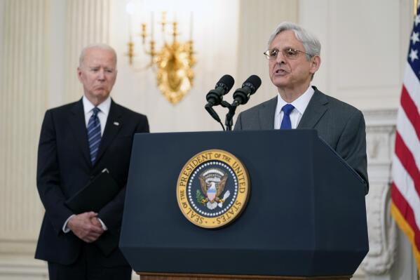 FILE - In this June 23, 2021 file photo, President Joe Biden listens as Attorney General Merrick Garland speaks during an event in the State Dining room of the White House in Washington to discuss gun crime prevention strategy. Garland traveled to Chicago last week to announce an initiative to crack down on violent crime and gun trafficking. The Justice Department’s 93 U.S. attorneys are likely to be central to that effort.(AP Photo/Susan Walsh)