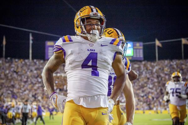 LSU running back John Emery Jr. reacts after scoring a touchdown against Alabama in an NCAA college football game in Baton Rouge, La., Saturday, Nov. 5, 2022. LSU won 32-31 in overtime. (Scott Clause/The Daily Advertiser via AP)