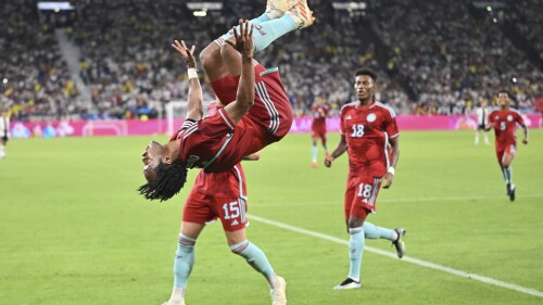 Colombia's Juan Cuadrado does a somersault after his penalty kick goal during an international friendly soccer match between Germany and Colombia at Veltins-Arena in Gelsenkirchen, Germany, Tuesday, June 20, 2023. (Bernd Thissen/dpa via AP)
