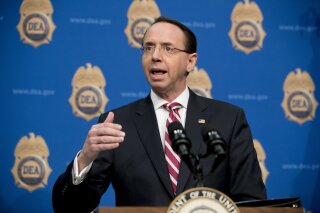 
              FILE - In this Jan. 31, 2019, file photo, Deputy Attorney General Rod Rosenstein, speaks before welcoming Vice President Mike Pence to speak to Drug Enforcement Administration employ...
