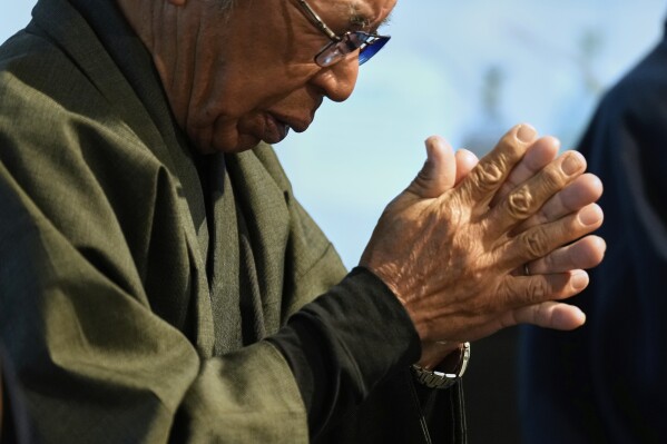 Yoshitaka Oishi and others chant "Orasho" prayers during their annual performance at the Ikitsuki Island Museum "Shima no Yakata" in Ikitsuki Island in Hirado, southern Japan, Tuesday, April 29, 2025. (AP Photo/Hiro Komae)