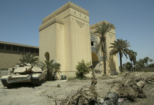 A U.S. Army tank is parked outside the Iraqi National Museum in Baghdad on May 6, 2003. (AP Photo/Murad Sezer, File)